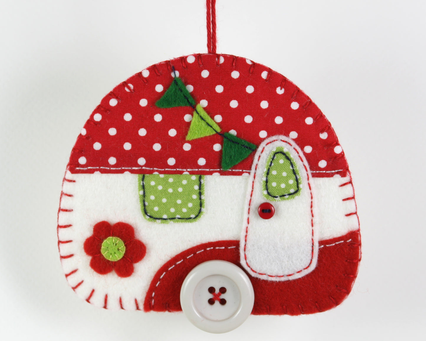 Large camper Christmas ornament in red and white