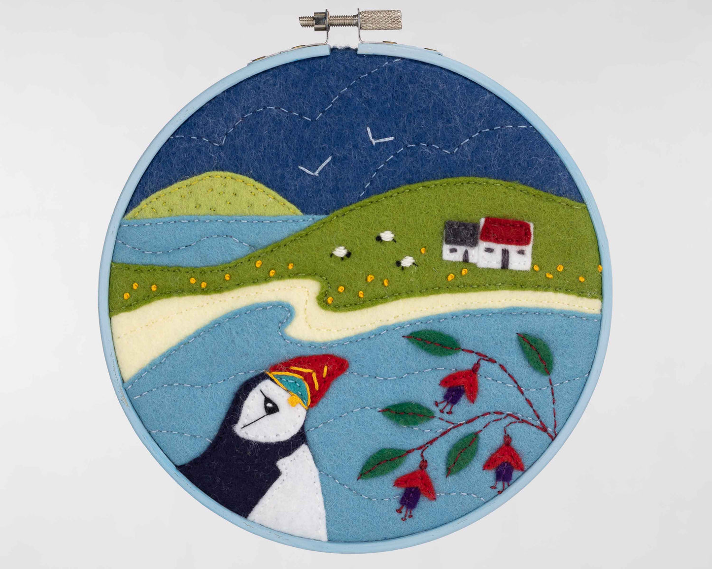 Hoop framed puffin embroidery, Puffin Cottage