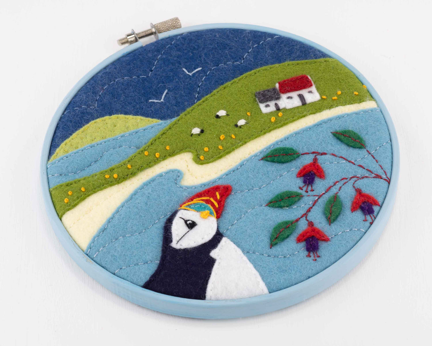 Hoop framed puffin embroidery, Puffin Cottage