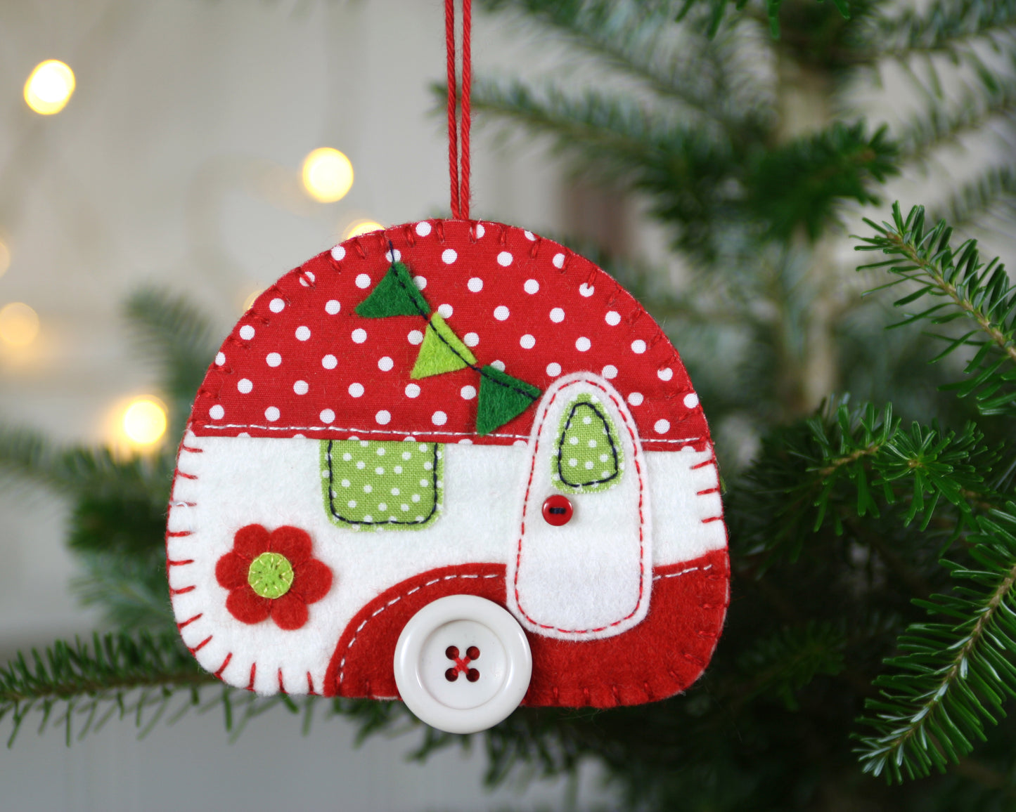 Large camper Christmas ornament in red and white