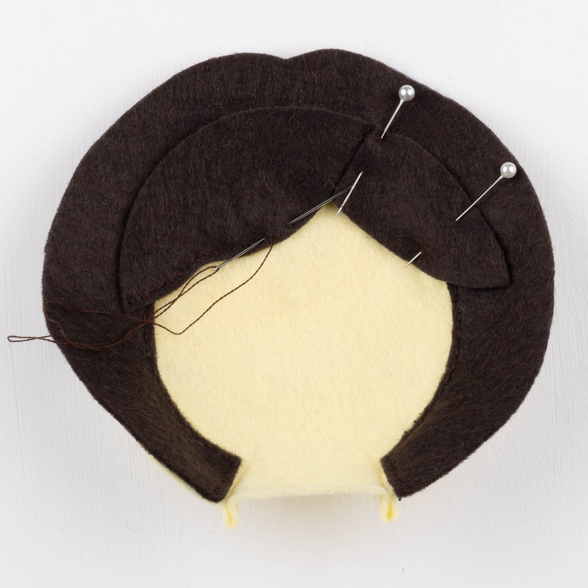 Example photo from the pattern, showing how to place the hair and fringe on the face.